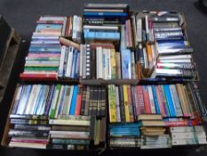 A pallet containing five boxes of books including novels, reference dictionaries etc.