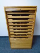 An Edwardian oak shutter door music chest.