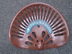 A cast iron W M Doyle & Co. tractor seat.