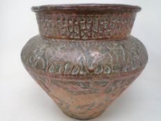 A 19th century Indian embossed copper planter depicting animals.