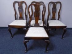 A set of four walnut Queen Anne style dining chairs