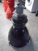 An industrial halogen spotlight (black).