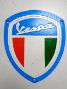 A cast iron wall plaque, Vespa.