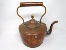 A Victorian copper kettle.