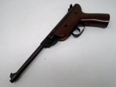 A Chinese .22 calibre air pistol together with a tin of Hobby pellets.