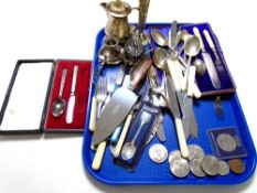 A tray containing assorted plated wares, cased cutlery, coins, crowns.