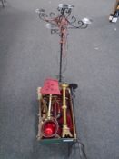 A box containing a fringed Persian rug, brass table lamp with shade,