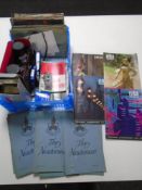 A box containing Falcon Zoom 18x6 field glasses, camera guides, Leica books, filters etc.