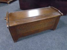 A carved oak blanket chest