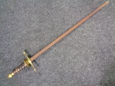 A brass hilted sword.