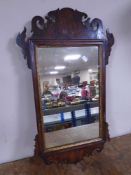 A Victorian Chippendale style wall mirror.