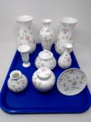 A tray containing nine pieces of Wedgwood Rosehip cabinet china with boxes.
