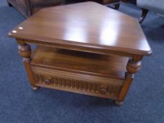 An Ercol Grasmere flap sided corner coffee table fitted with a drawer.