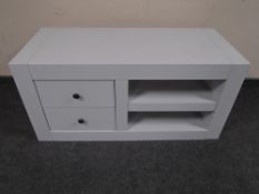 A painted contemporary entertainment stand fitted with shelves and two drawers.
