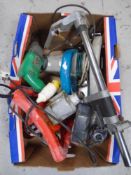 A box containing power tools including Black & Decker sander, electric drill, circular saw,