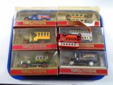 A tray of six boxed Matchbox models of yesteryear die cast wagons and busses together with one