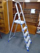 A Werner aluminium folding five tread stepladder.