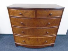 A Victorian style two-over-three bow fronted five drawer chest.