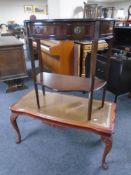 An inlaid two tier serpentine front hall table fitted with a drawer together with a coffee table