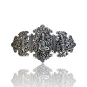 A silver belt buckle, probably Burmese.
