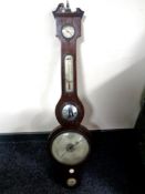 A George III barometer with silvered dial.