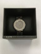 An encrusted wristwatch by Marc Jacobs, in retail box.