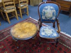 An Edwardian beech framed nursing chair upholstered in tapestry fabric together with a circular