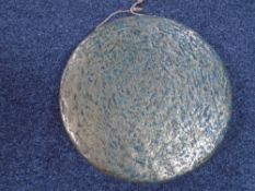 A brass dinner gong (diameter 29cm).