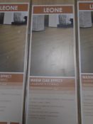 Five packs of Leone warm oak effect laminate flooring.