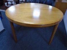 A mid-20th century Scandinavian circular teak extending dining table.