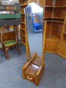 A narrow walnut Art Deco cheval mirror fitted with a drawer.