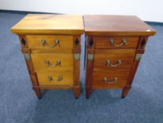 A pair of Empire style three drawer bedside chests with drop handles.