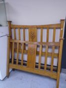 A pair of Edwardian oak Art Nouveau rail bed ends.