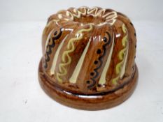 A slip ware jelly mould.