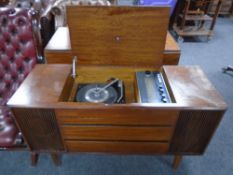 A mid-20th century Bush Solid State stereo system in cabinet, 117cm wide by 43cm deep by 68cm high.