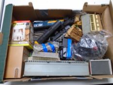 A box containing Hornby/Triang OO gauge trains and buildings.
