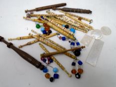 A box containing a quantity of lace bobbins including bone examples together with four pieces of