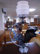 A chrome Art Deco table lamp with pink glass shade (height 57.