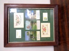 A framed montage of World War I postcards.