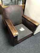 A 1930's oak framed fireside armchair.