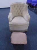 A bedroom chair upholstered in button dralon together with a footstool.