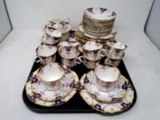 A collection of 39 pieces of antique floral patterned tea china.