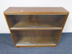 A 20th century oak sliding glass door bookcase,