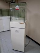 A jeweller's glass display cabinet on stand.