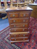 A Chapman's Siesta mahogany miniature chest on chest.