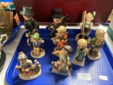 A tray of nine Goebel figures of girls and boys.