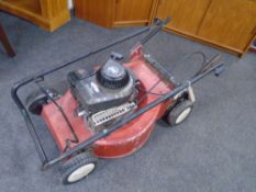 A Briggs and Stratton classic petrol self drive lawn mower.