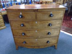 A Victorian mahogany two-over-three bow fronted five drawer chest.