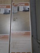 Five packs of Leone warm oak effect laminate flooring.