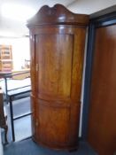 A 19th century continental birch double corner cabinet.